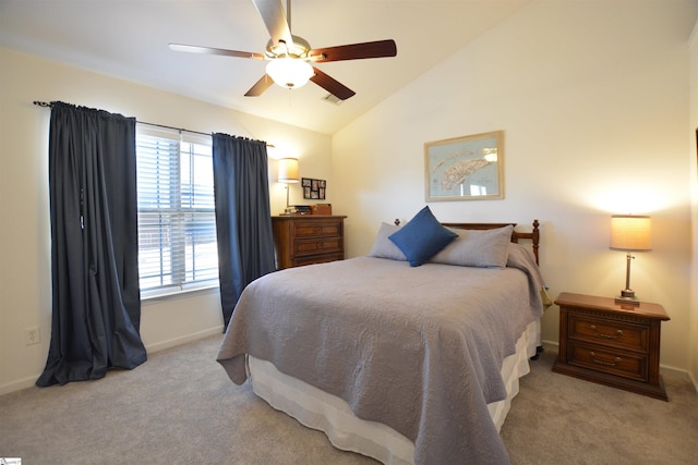 carpeted bedroom with lofted ceiling, a ceiling fan, and baseboards