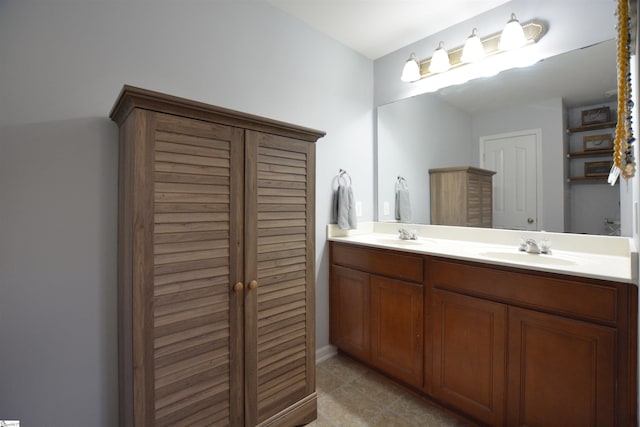 full bathroom with a sink and double vanity