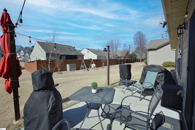 view of patio featuring a residential view and a fenced backyard