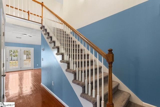 stairs featuring baseboards and wood finished floors