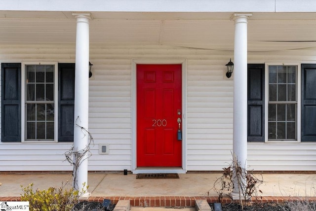 doorway to property featuring a porch