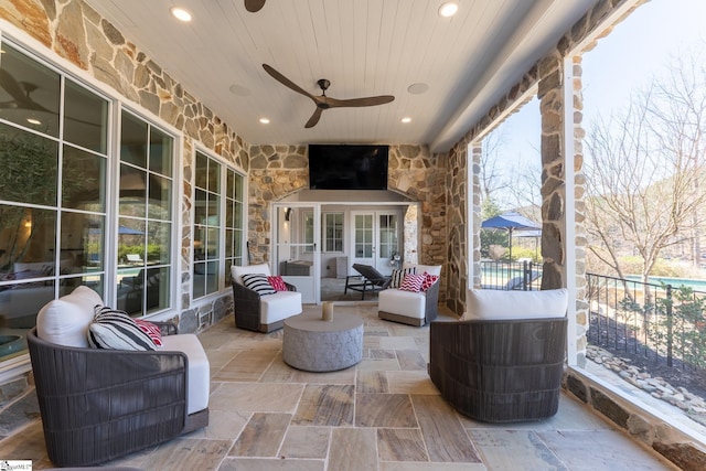 view of patio / terrace featuring a ceiling fan and an outdoor living space