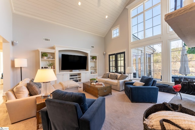 living area featuring visible vents, light colored carpet, wooden ceiling, french doors, and high vaulted ceiling