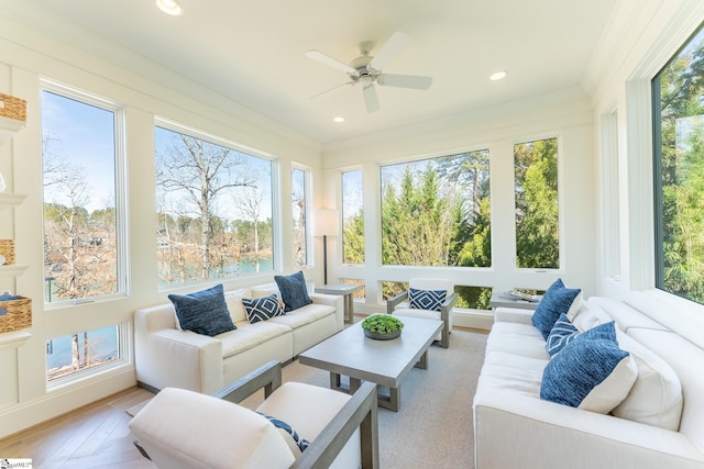 sunroom / solarium featuring ceiling fan and a wealth of natural light