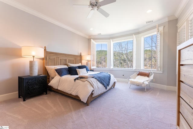 bedroom featuring crown molding, baseboards, visible vents, and light colored carpet