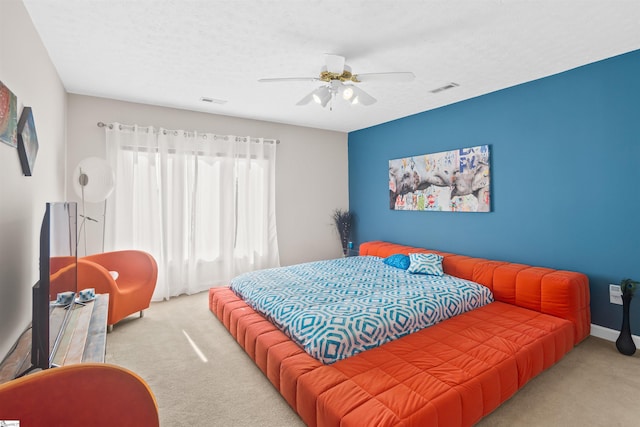 bedroom featuring carpet, visible vents, and ceiling fan