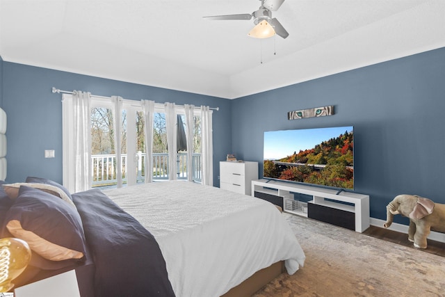 bedroom featuring access to outside, baseboards, ceiling fan, and wood finished floors