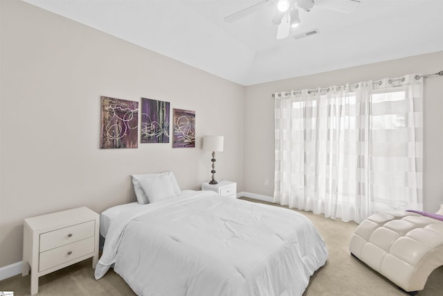 bedroom with carpet floors, baseboards, visible vents, and a ceiling fan