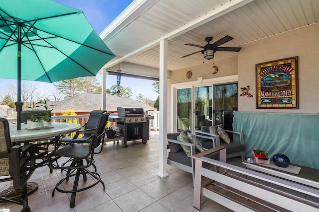 view of patio / terrace with outdoor dining space, ceiling fan, and grilling area