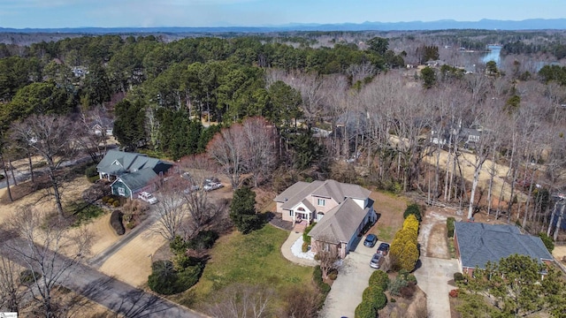 drone / aerial view with a view of trees