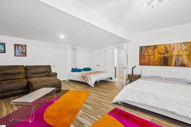 bedroom featuring wood finished floors and a ceiling fan