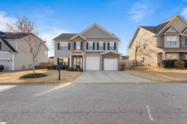 view of front of house with a garage, stone siding, fence, and concrete driveway