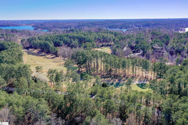 birds eye view of property featuring a view of trees