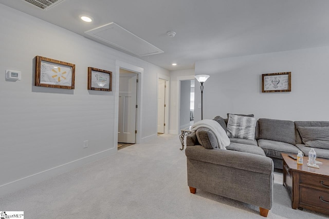 living room featuring recessed lighting, light carpet, visible vents, baseboards, and attic access