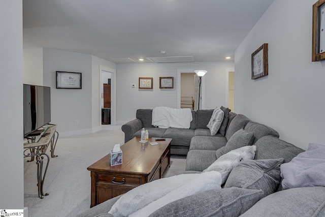 carpeted living room featuring attic access, recessed lighting, and baseboards