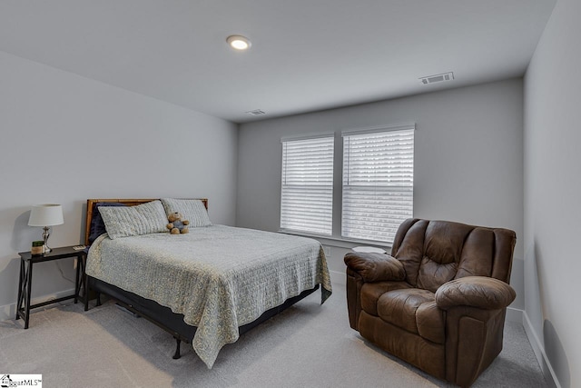 bedroom featuring carpet floors, visible vents, and baseboards