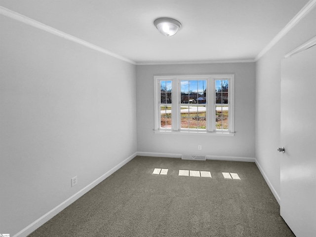 carpeted empty room featuring visible vents, baseboards, and ornamental molding