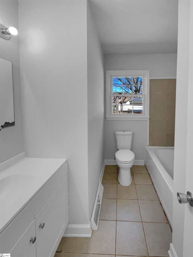 bathroom with tile patterned flooring, visible vents, baseboards, toilet, and vanity