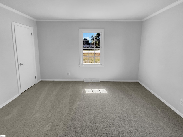 unfurnished room with baseboards, carpet floors, visible vents, and crown molding