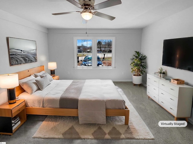 carpeted bedroom with baseboards and ceiling fan