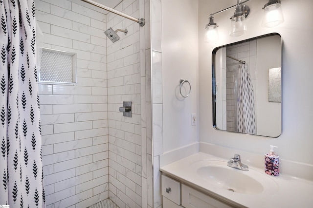 full bath with a shower stall and vanity