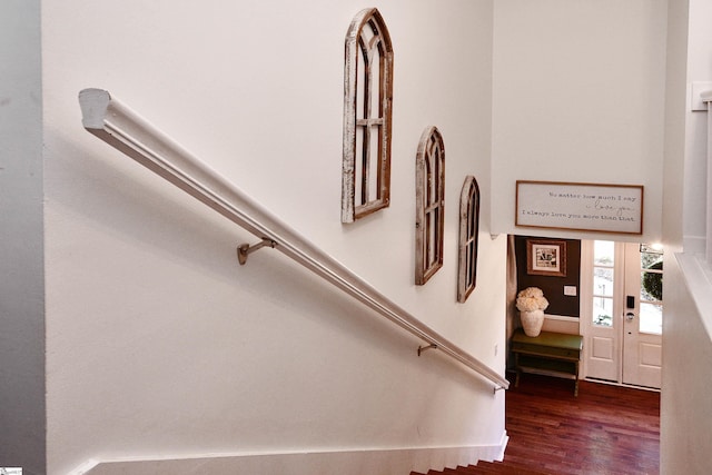 stairway featuring wood finished floors