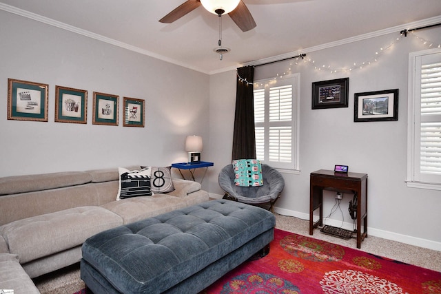 living room featuring carpet, ornamental molding, ceiling fan, and baseboards