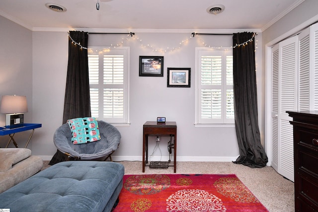 sitting room featuring visible vents, crown molding, and baseboards