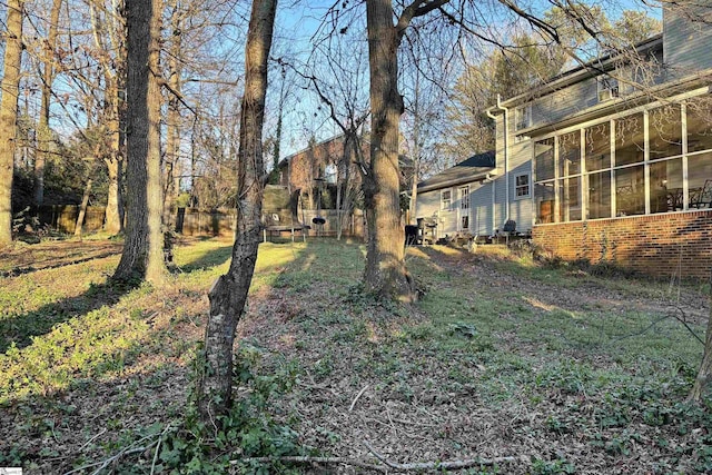 view of yard featuring a sunroom