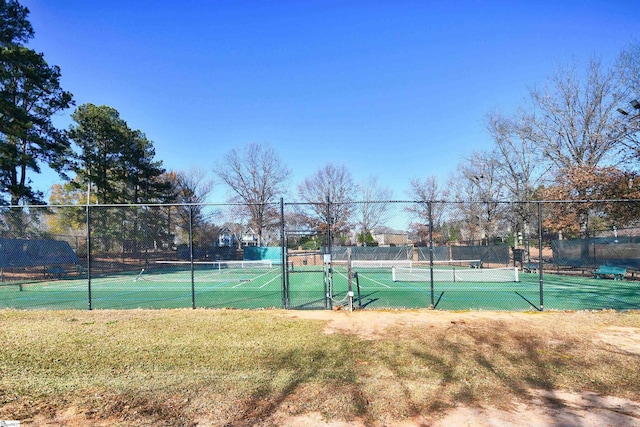 view of tennis court with fence