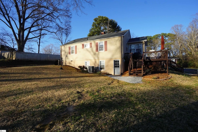 back of house featuring a wooden deck, stairway, central AC, and a yard