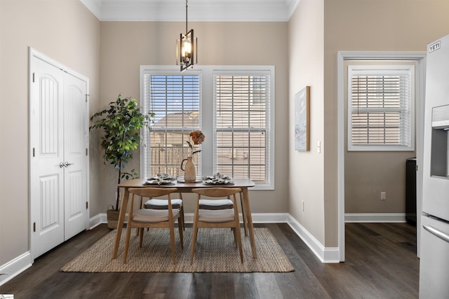 dining room featuring a wealth of natural light, baseboards, dark wood-style floors, and ornamental molding