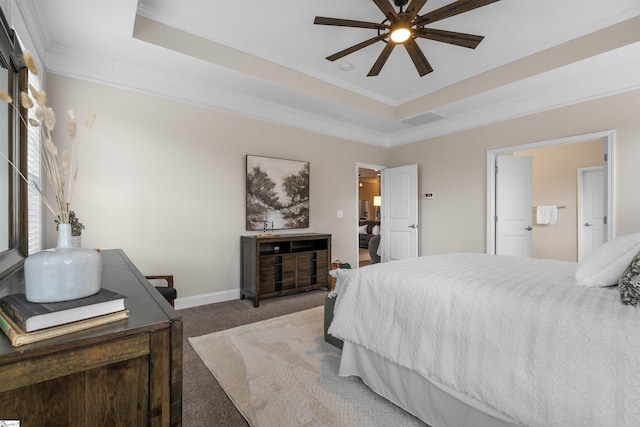 carpeted bedroom featuring a tray ceiling, baseboards, a ceiling fan, and crown molding