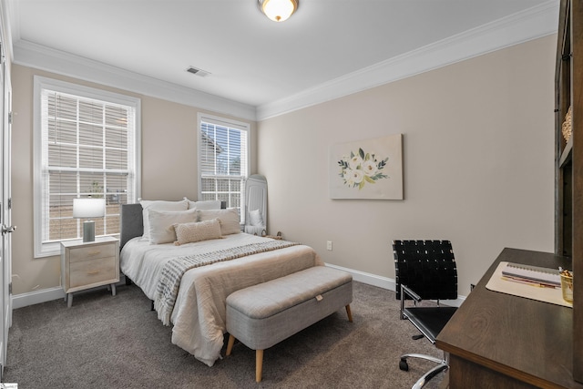 carpeted bedroom featuring visible vents, baseboards, and ornamental molding