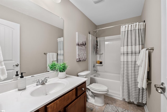 bathroom with vanity, toilet, and shower / bath combo with shower curtain