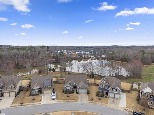 bird's eye view with a water view and a residential view