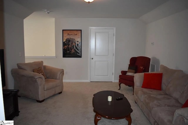 carpeted living area featuring vaulted ceiling, visible vents, and baseboards