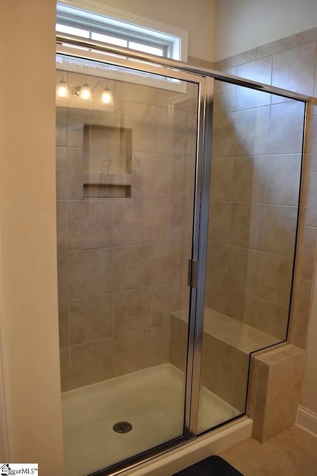 bathroom featuring a shower stall