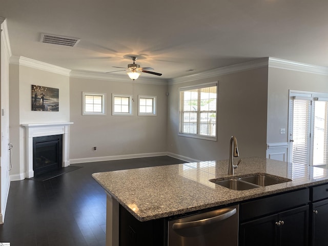 kitchen with visible vents, a sink, stainless steel dishwasher, crown molding, and open floor plan