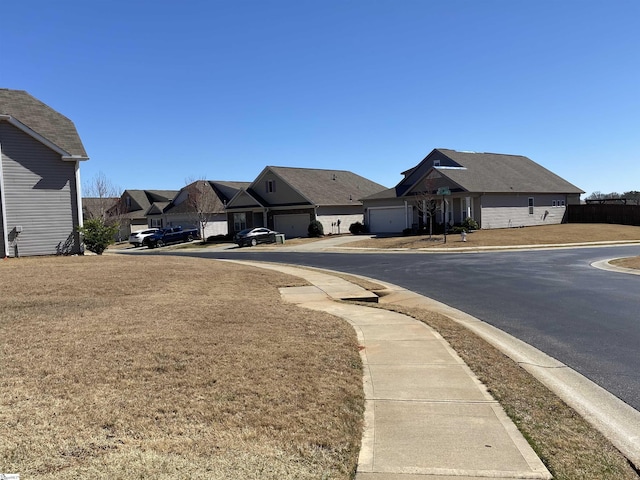 view of road featuring a residential view, curbs, and sidewalks