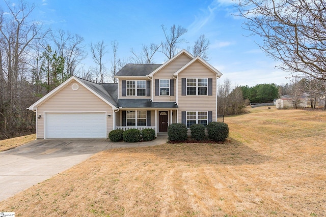 traditional home featuring a garage, concrete driveway, a porch, and a front lawn