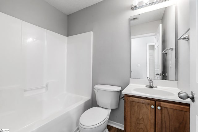 full bathroom featuring a textured ceiling, toilet, vanity, visible vents, and shower / bathing tub combination