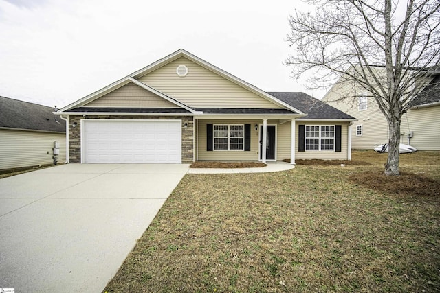 ranch-style house with a garage, driveway, and a front lawn