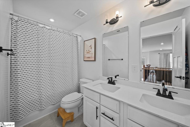 full bath featuring toilet, a sink, visible vents, and tile patterned floors