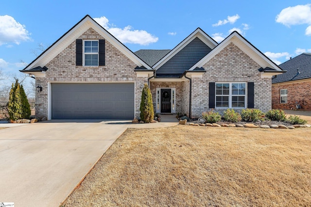 view of front of home with a garage, concrete driveway, brick siding, and a front lawn