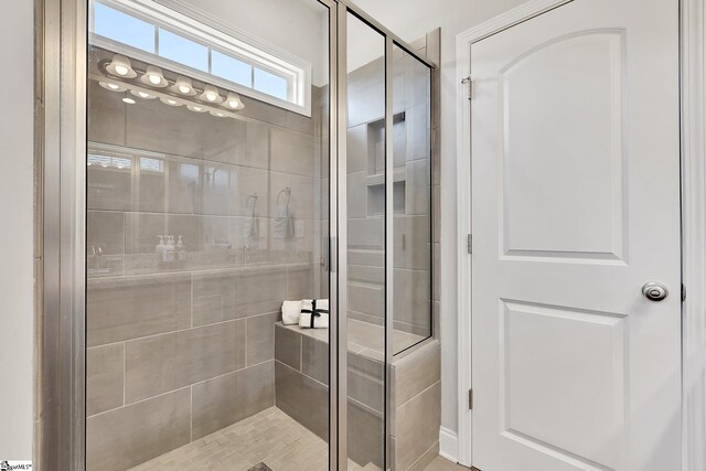 bathroom with a shower stall