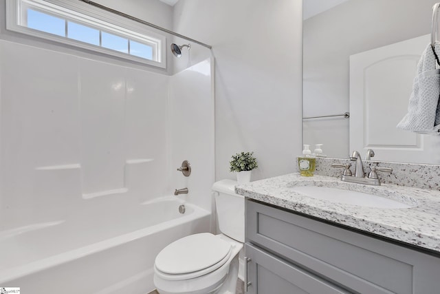 full bathroom featuring shower / tub combination, vanity, and toilet