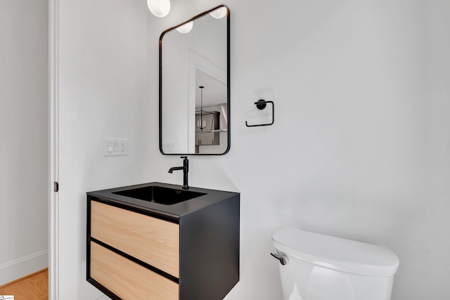 half bath with vanity and toilet