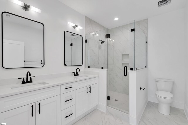 full bath featuring marble finish floor, a sink, a marble finish shower, and baseboards