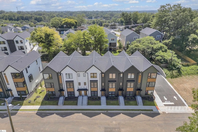 birds eye view of property with a residential view